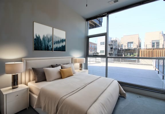 Bedroom with floor to ceiling windows in 2 bedroom apartment at Highpoint Lincoln Park on Fullerton in Chicago