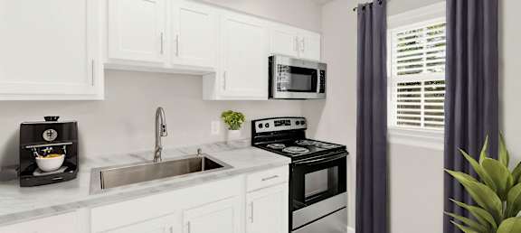 a kitchen with white cabinetry and black appliances and a window