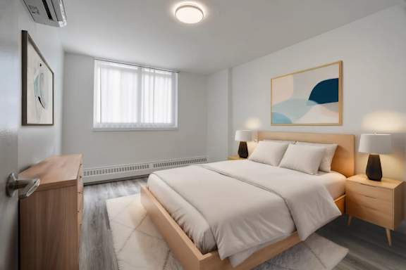 A bedroom with a large bed, a nightstand, and a painting on the wall. at 177 Saint George in Toronto, CA