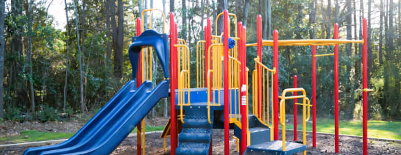 a playground with slides and a picnic table