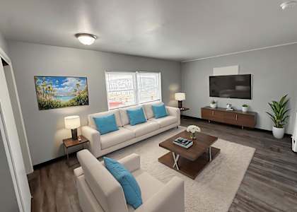 A living room with a white couch, a coffee table, and a painting on the wall.