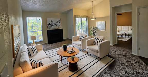 A living room with a fireplace and a couch.
