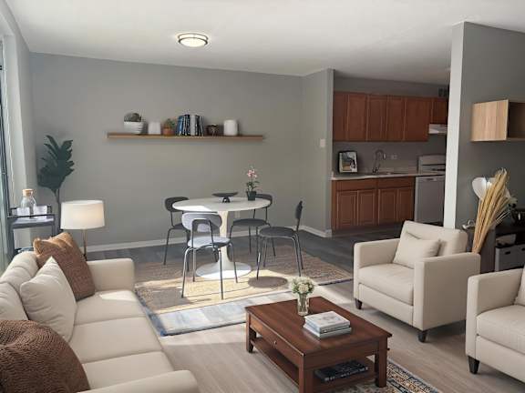 A kitchen with a bar stool and a couch.