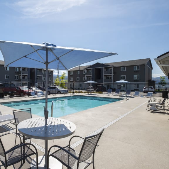 Swimming pool with lounge seating and tables