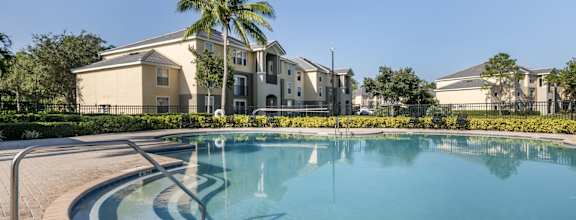 Resort Style Swimming Pool with Building Exterior in the Background
