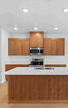 a kitchen with a large island in the middle of it