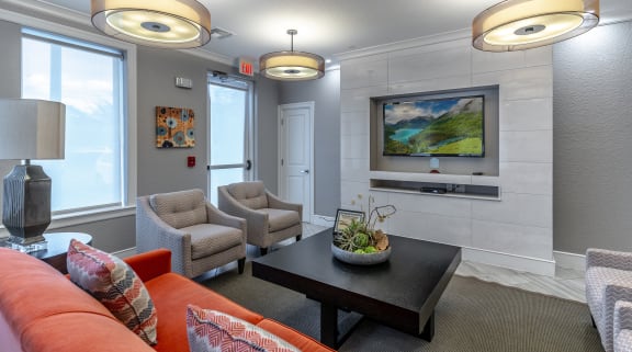 a living room with couches chairs and a coffee table
