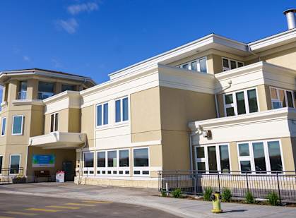 a large building with a blue sky in the background
