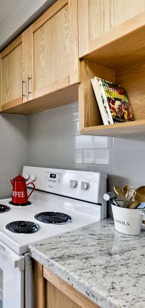 a kitchen with white appliances and wooden cabinets