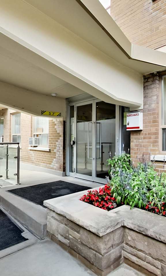 the preserve at cardinal heights front entrance to a brick building with flowers and plants