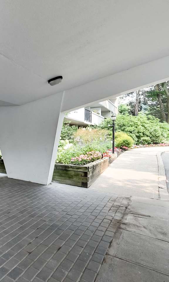 a view of the front entrance of a building with glass doors