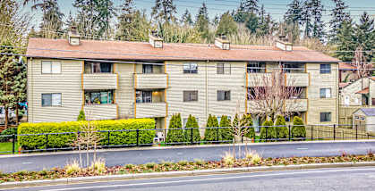 an apartment building on the side of a street