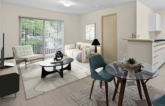 A modern living room with a glass table surrounded by chairs.