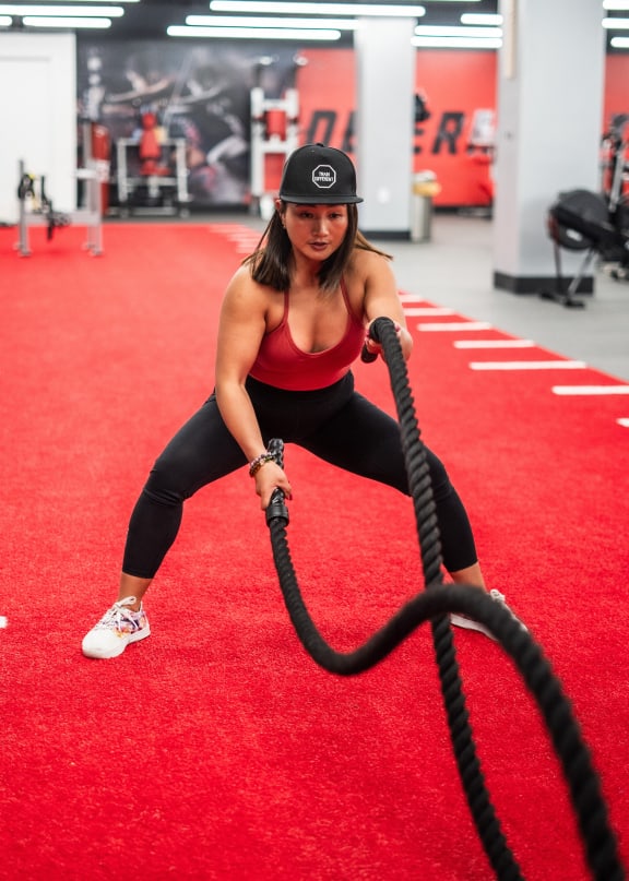 a woman holding a hose on a red carpet in a gym at Market Square Place, Pittsburgh, PA, 15222