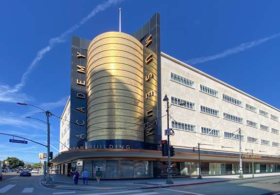 The exterior of the Academy building is shown on a clear day.