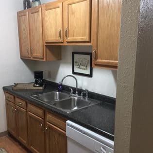 a bathroom with a sink and a toilet and a shower