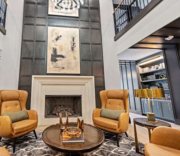a living room filled with furniture and a fire place
