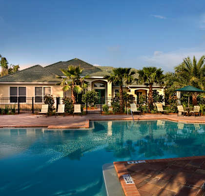 a house with a swimming pool in front of it