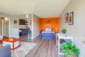 Thumbnail 6 of 25 - Las Brisas Apartments in Colton, CA with hardwood flooring, stylish decor, and access to living room