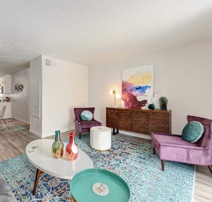 a living room with a couch and a table at The Legacy Apartments, California