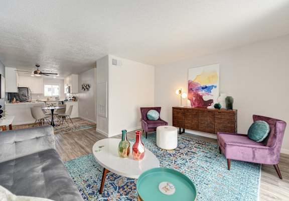 a living room with a couch and a table at The Legacy Apartments, California