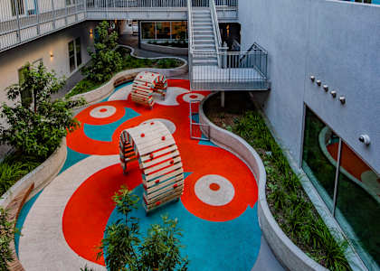 A playground area with a slide and a ball pit.