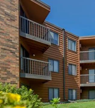 an apartment building with balconies on the side of it