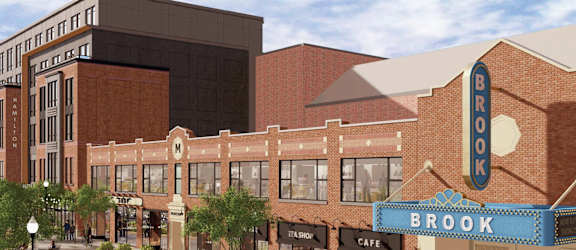 A street view of a building with a cafe named Brook.
