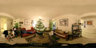 a living room filled with furniture and a christmas tree