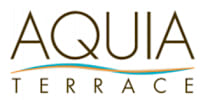 The image shows a logo with the text "AQUA TERRAGE" in stylized font, with the letters "AQUA" in gold and "TERRAGE" in a combination of gold and blue colors.