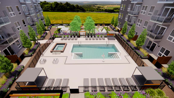 A pool surrounded by buildings and trees.