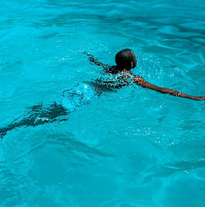 A person swimming in a pool.