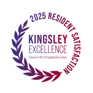 A logo with the words "Ilesley Excellence" surrounded by a laurel wreath.