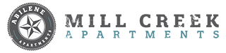 The image is of a logo for Mill Creek Apartments.