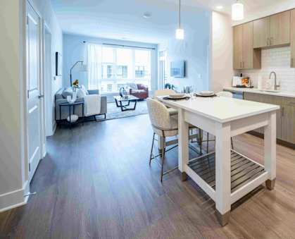 a kitchen with a white island in the middle