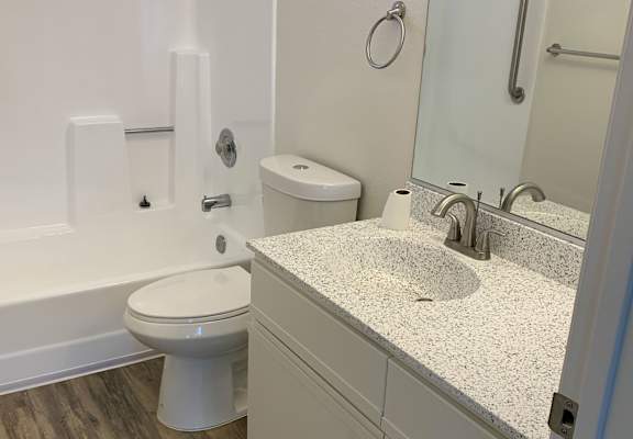 a bathroom with a toilet sink and bathtub