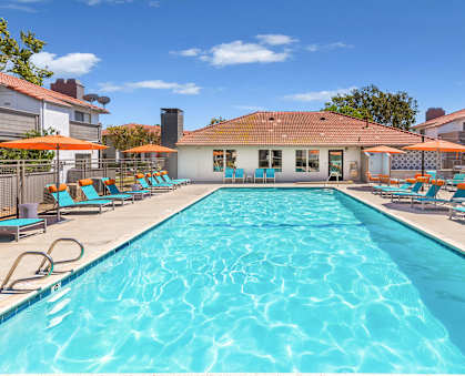 our apartments have a swimming pool with lounge chairs and umbrellas