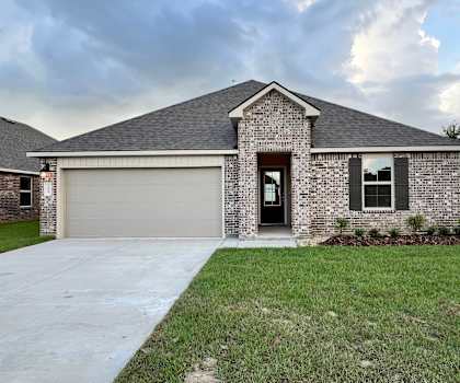 A house with a grey roof and a garage door.