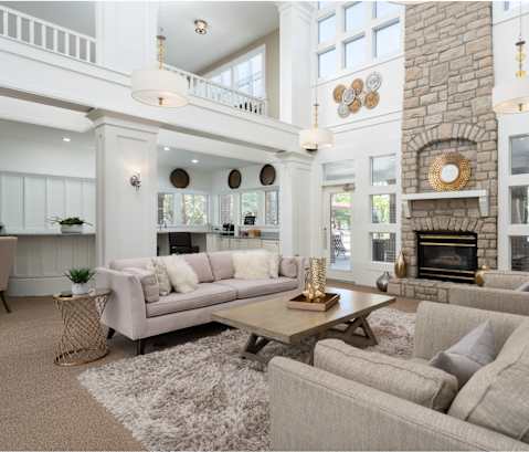 a white living room with couches and a table