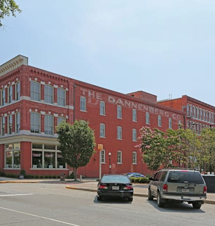A red brick building with the words "The Dannenberg Center" on it.