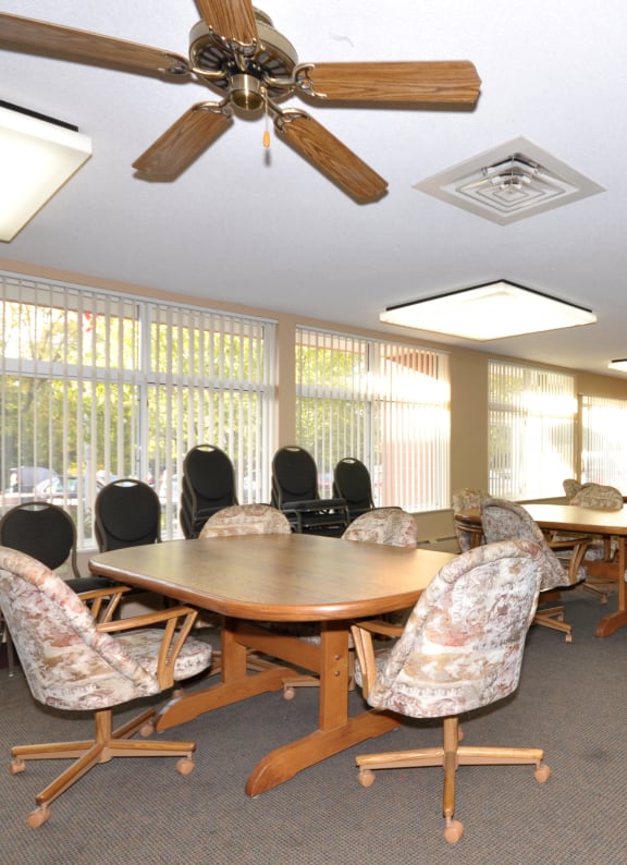 a conference room with a large table and chairs