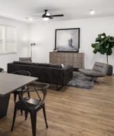 a living room with a dining room table and a couch