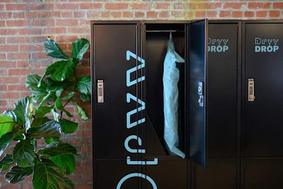 Three black lockers with the word "Dry" written on them.