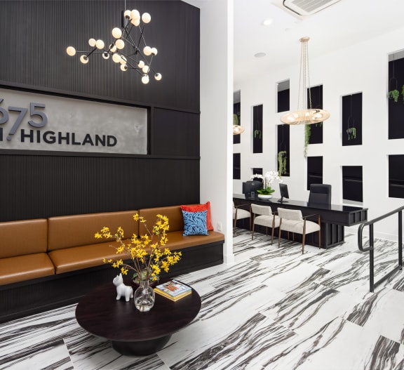 the lobby of 625 north highland with a couch and a table