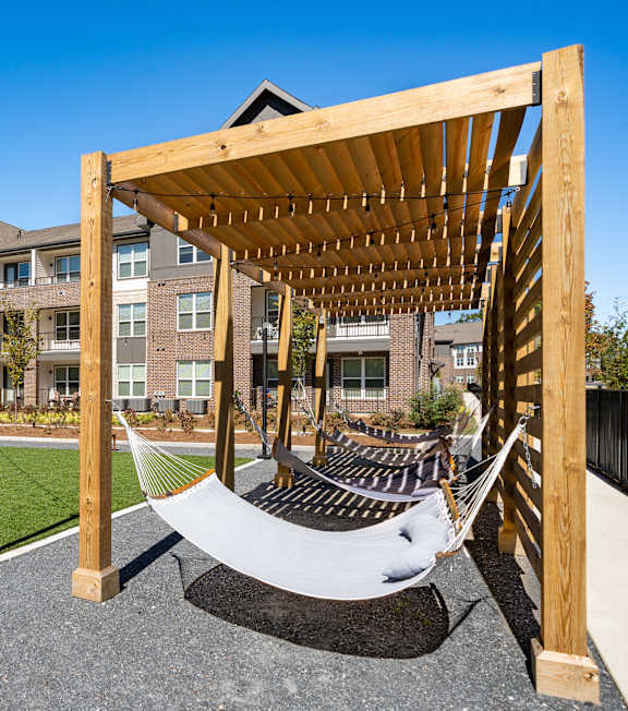 a hammock swing in front of an apartment building