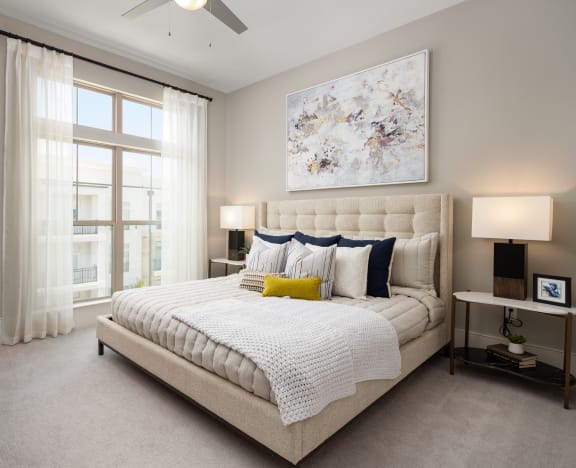 a bedroom with a bed and a window