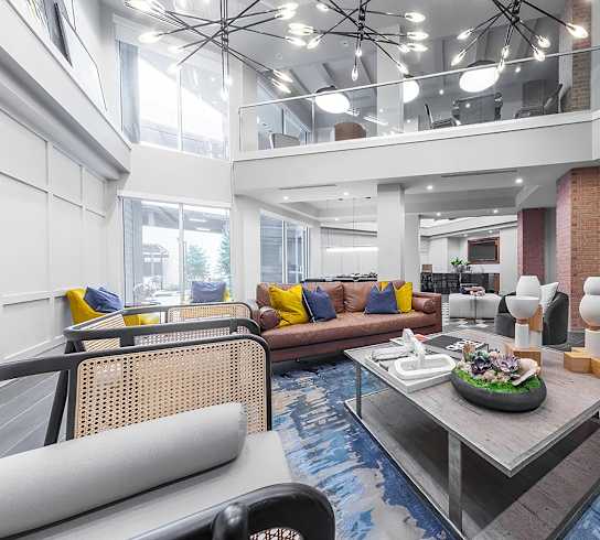 a living room with couches and a table