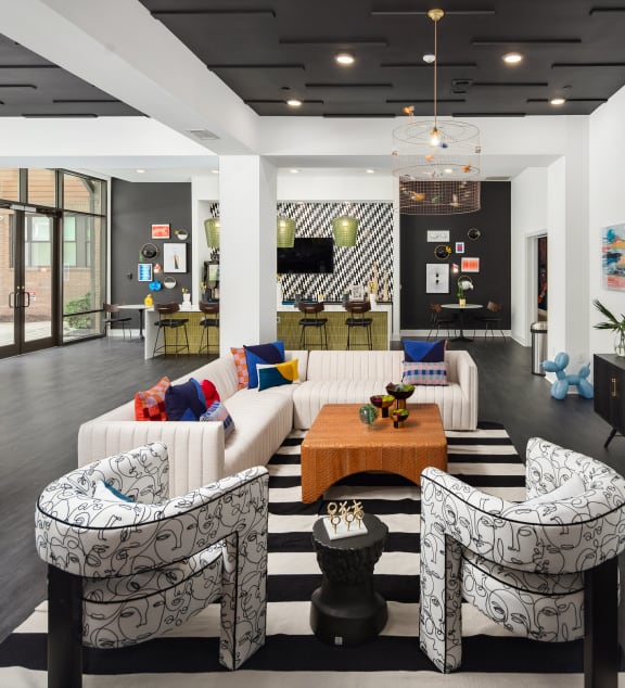 a living room with couches and a table and a television