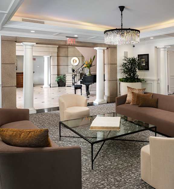 a game room with a pool table and couches