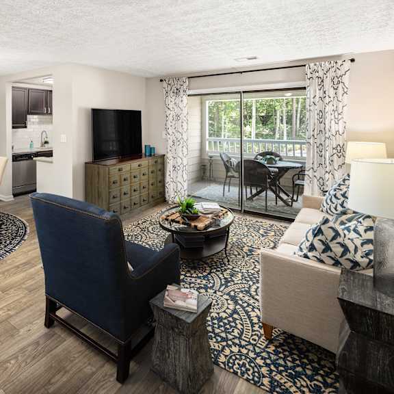 A living room with a dining table and chairs.